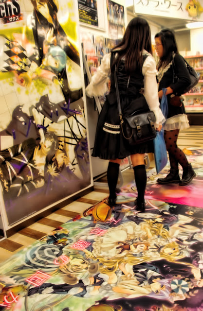 Japanese girls in a colorful manga shop in Tokyo